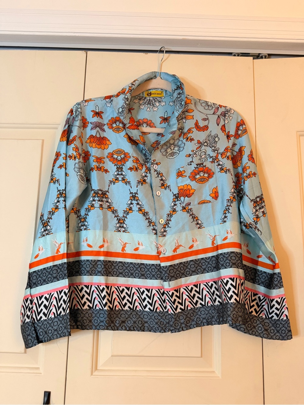 Light Blue Floral Button-Up Blouse with Orange Accents